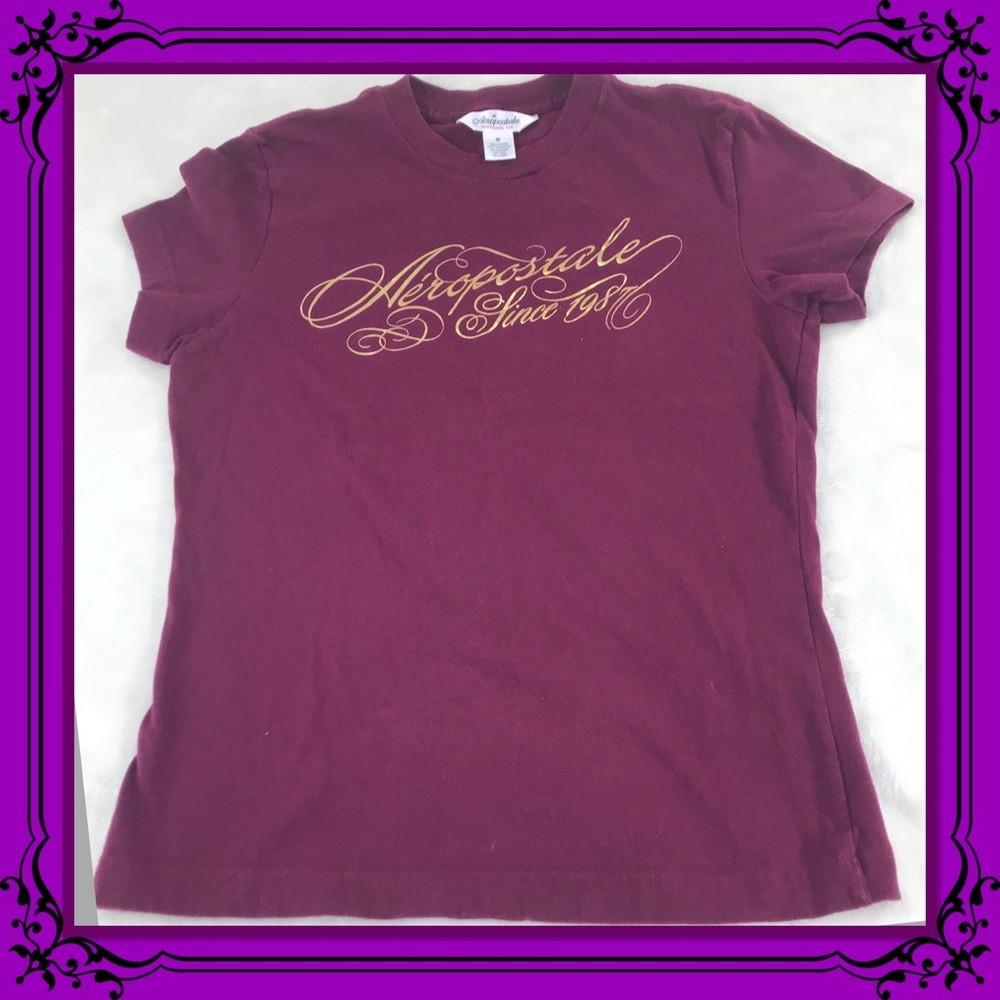 Aeropostale since 1987 in gold on magenta tee